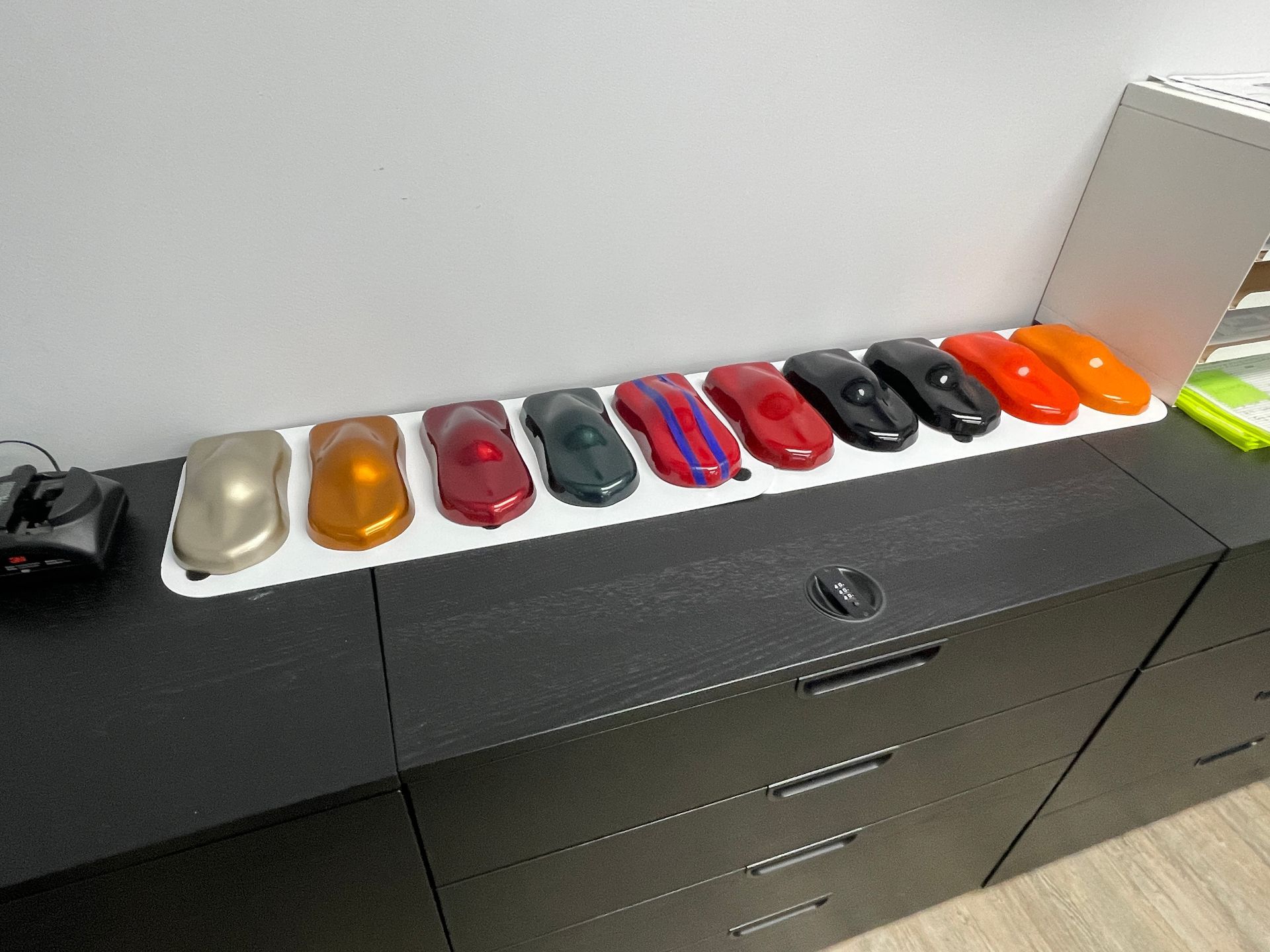 A bunch of different colored objects are on a table