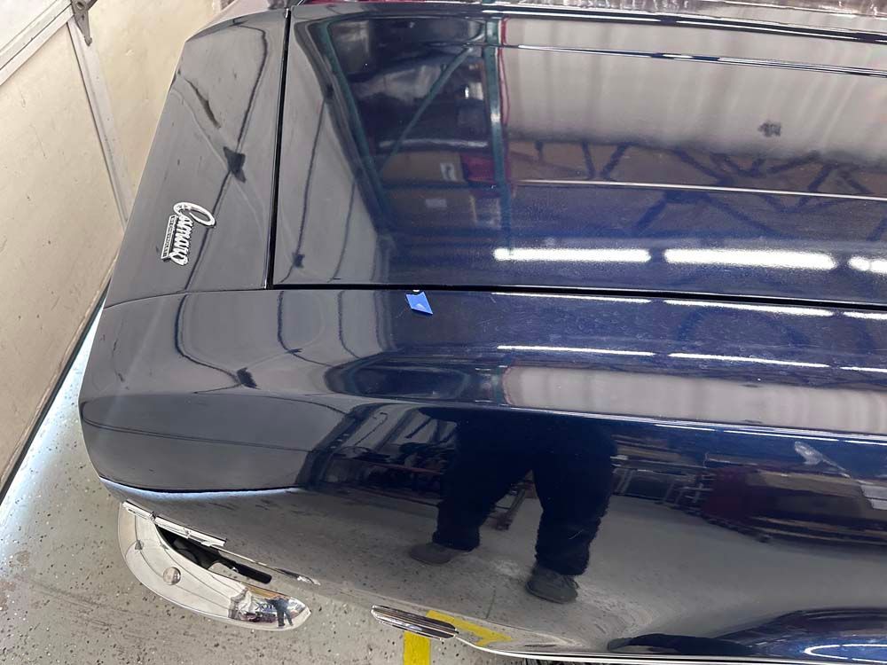 A black car with the word camaro on it