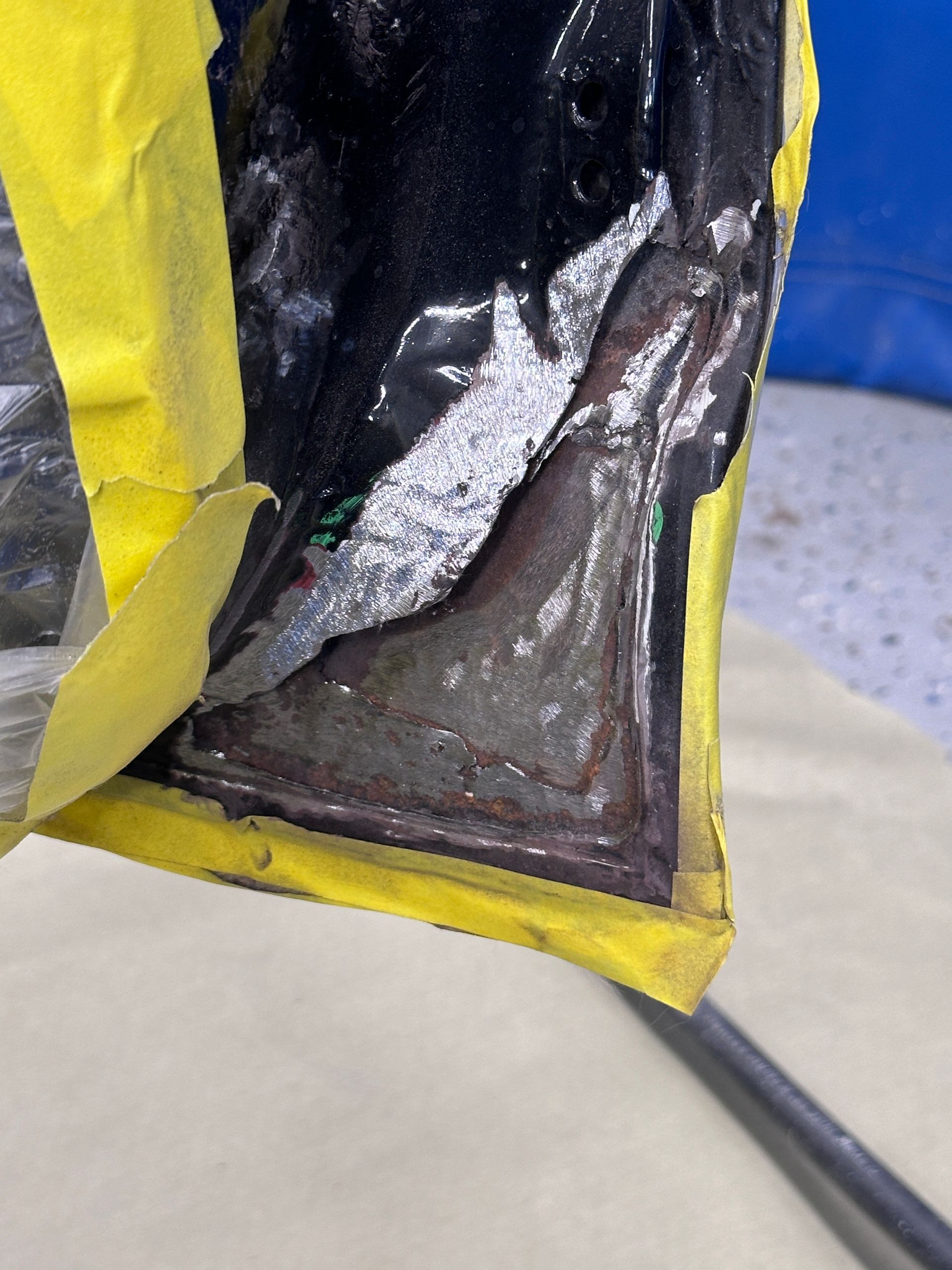 A piece of tape is covering a piece of metal