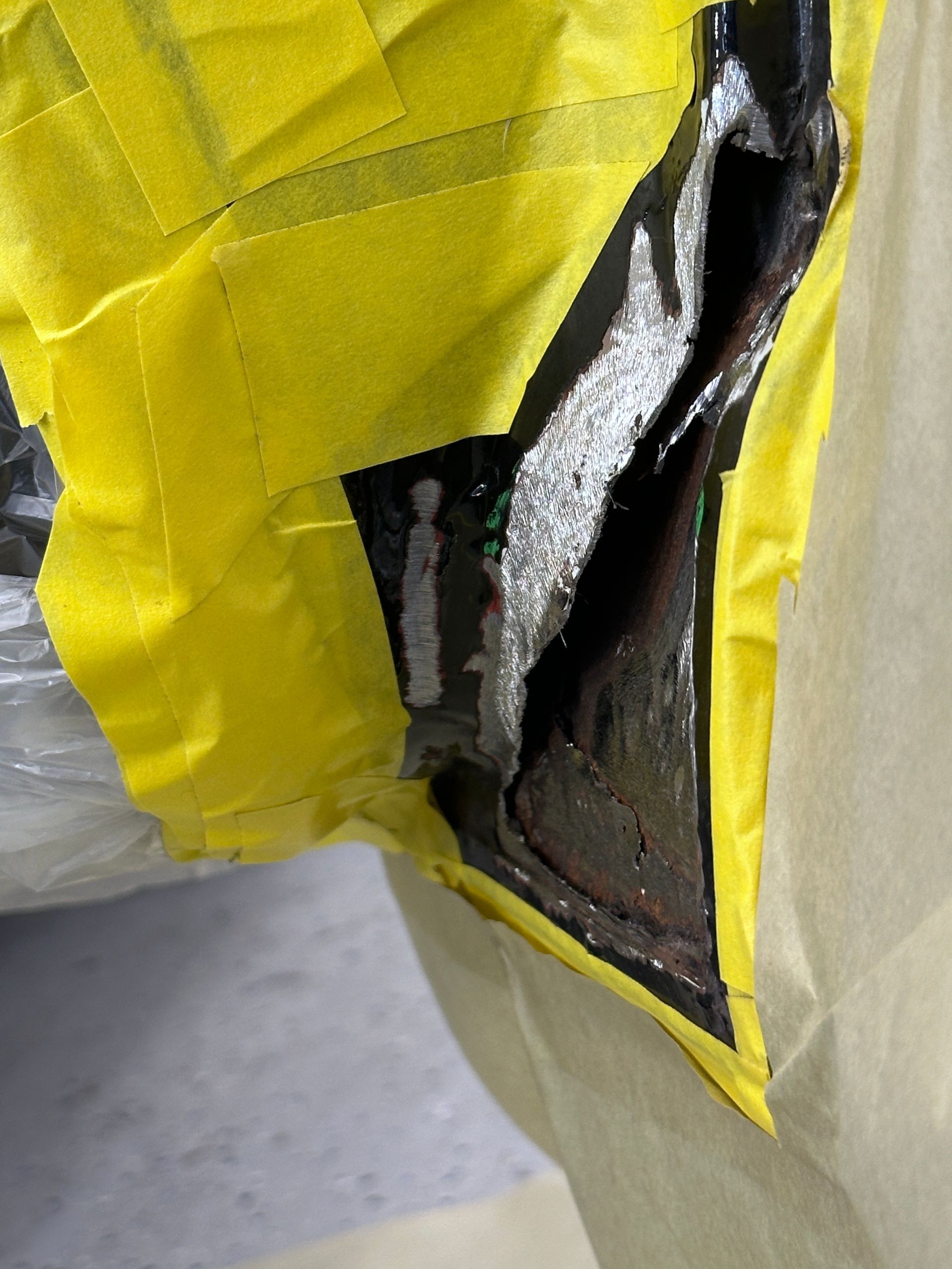 A piece of yellow tape has a hole in it