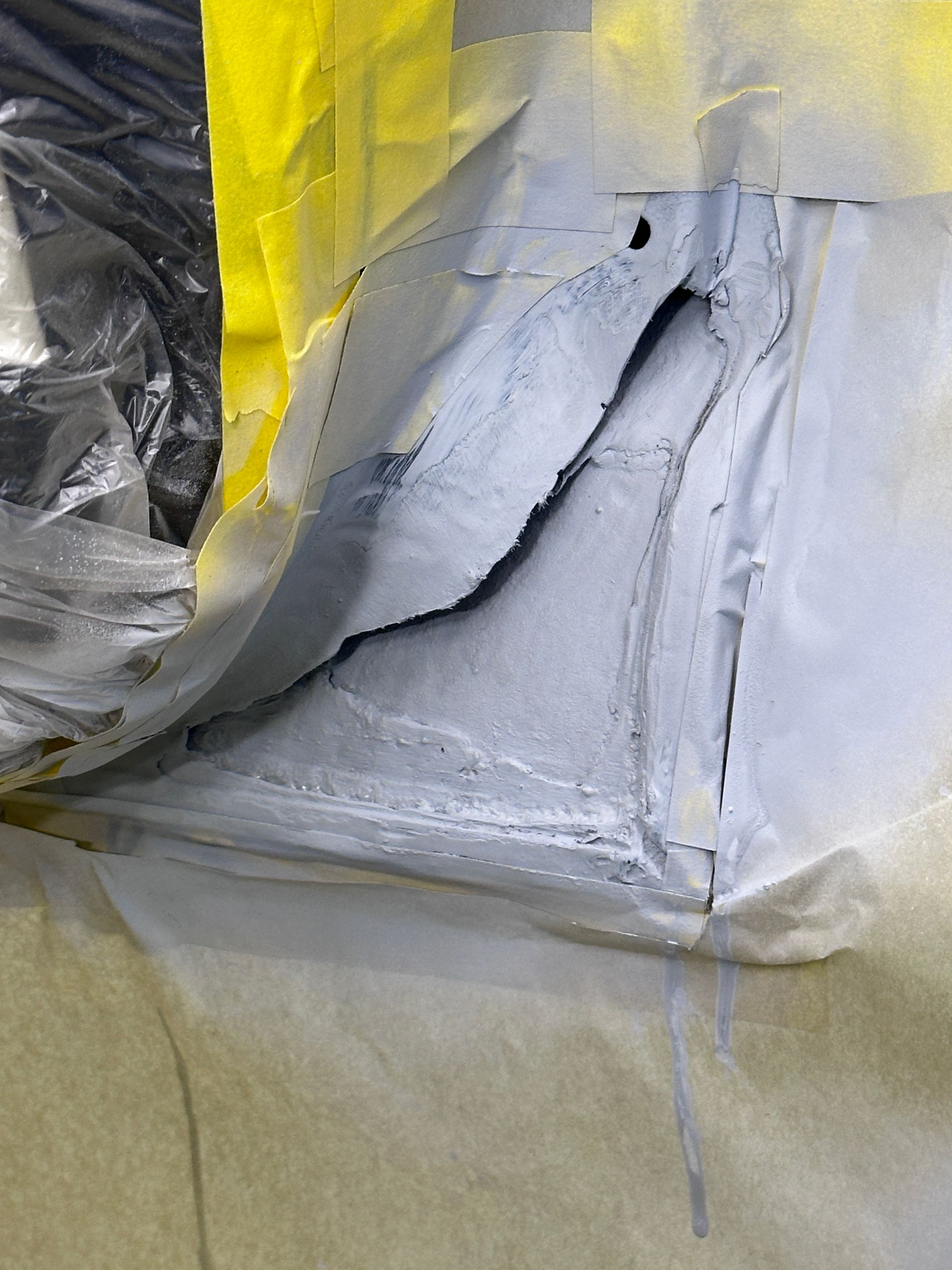 A close up of a piece of paper with a hole in it