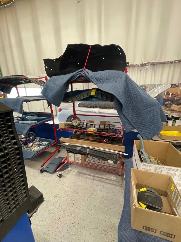 A car is being worked on in a garage.