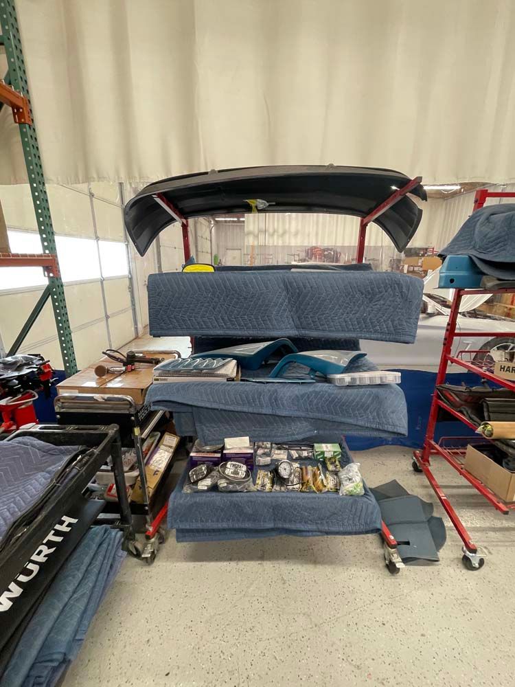 A bunch of boxes are stacked on top of each other in a warehouse.