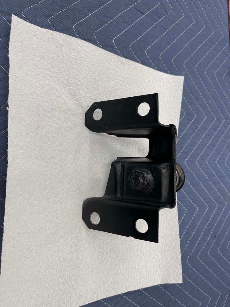 A piece of metal is sitting on a piece of paper.