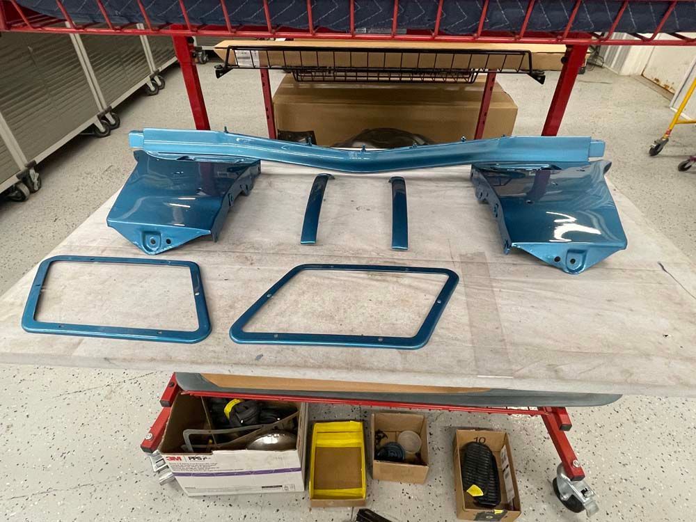 A bunch of blue parts are sitting on a table