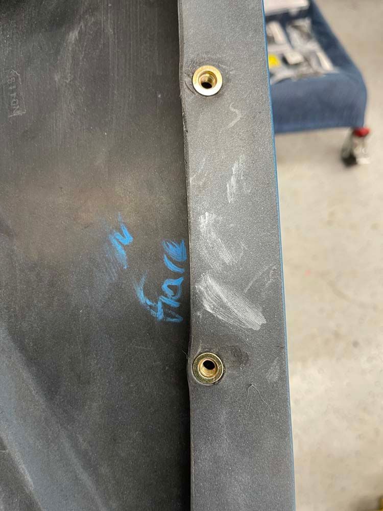 A close up of a piece of metal with holes in it.