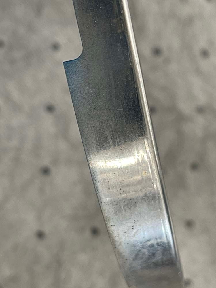 A close up of a metal ring on a table.