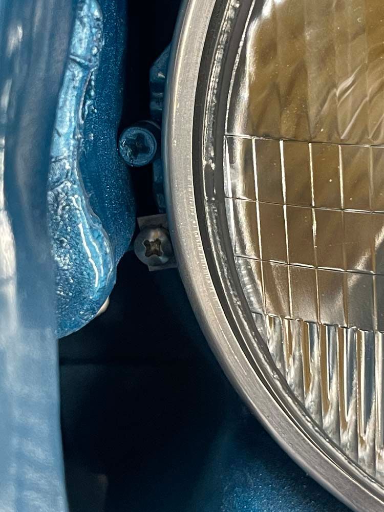 A close up of a headlight on a car.