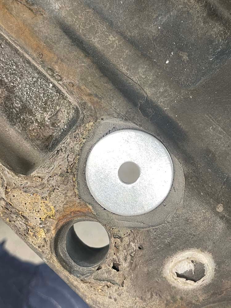 A close up of a metal object with a hole in it.