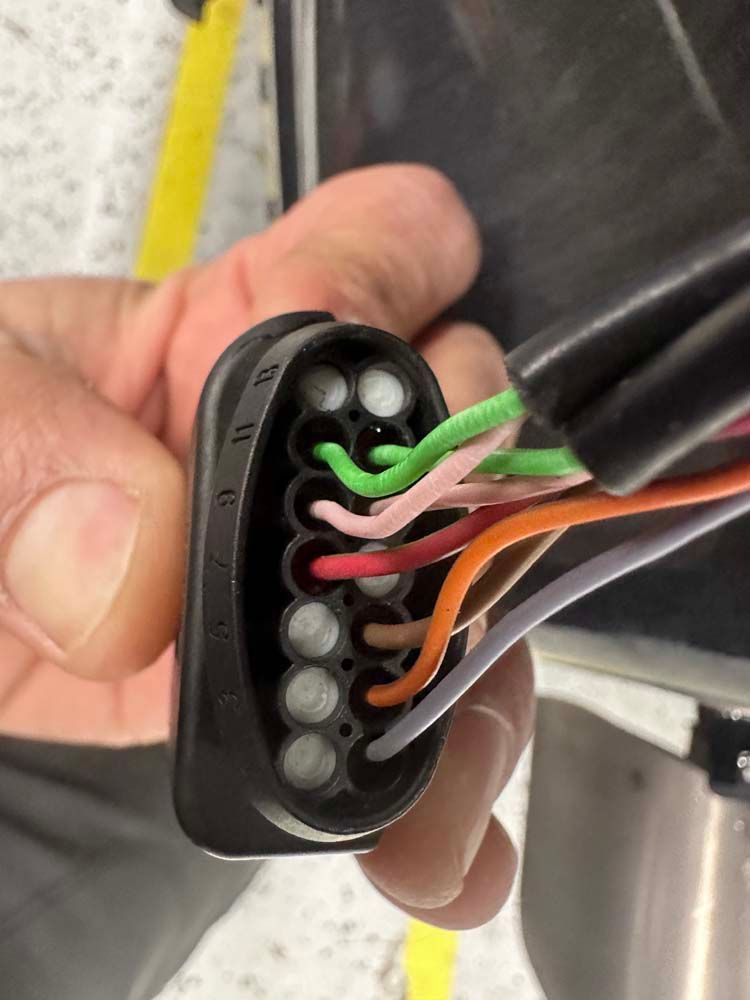 A person is holding a bunch of wires in their hand