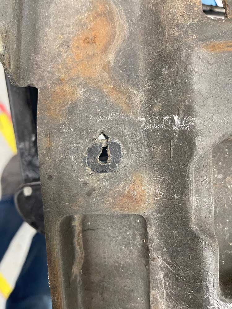 A close up of a metal object with a hole in it.