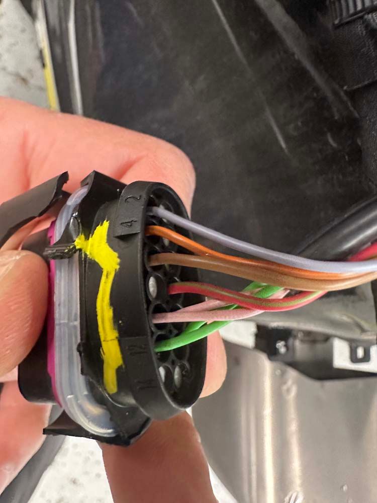 A person is holding a bunch of wires in their hand.