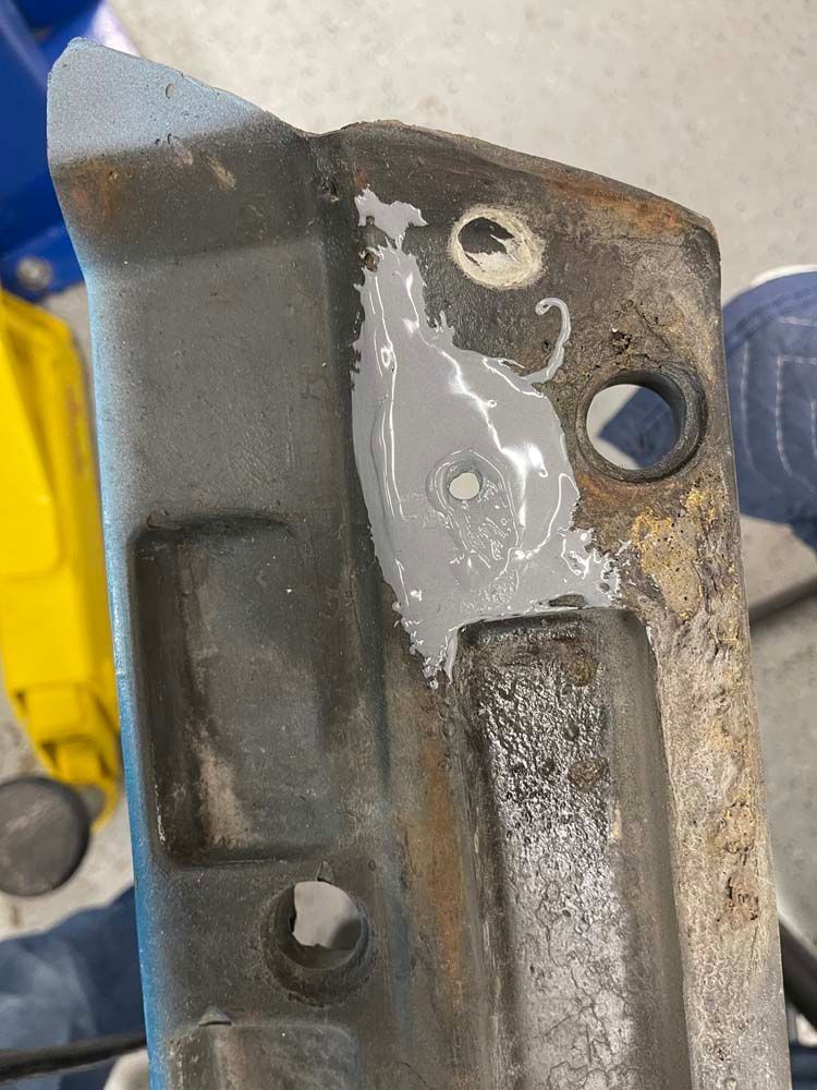 A close up of a piece of metal with holes in it.