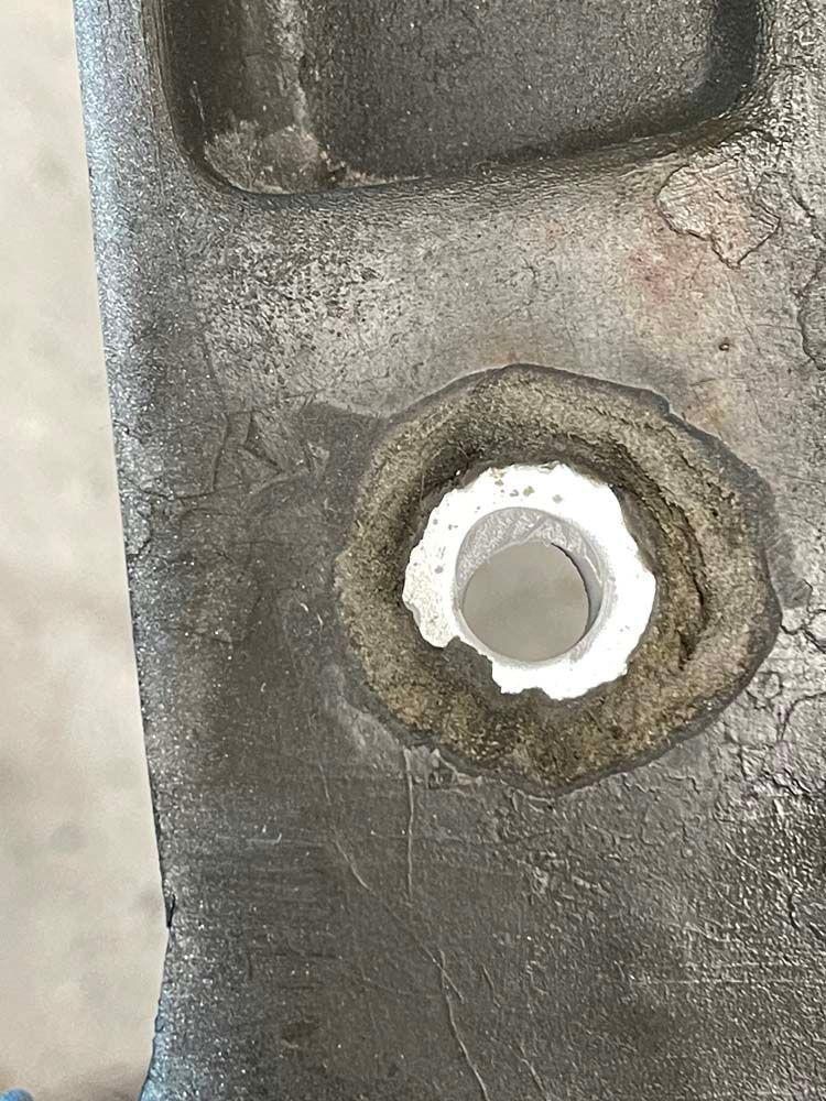 A close up of a metal object with a hole in it.