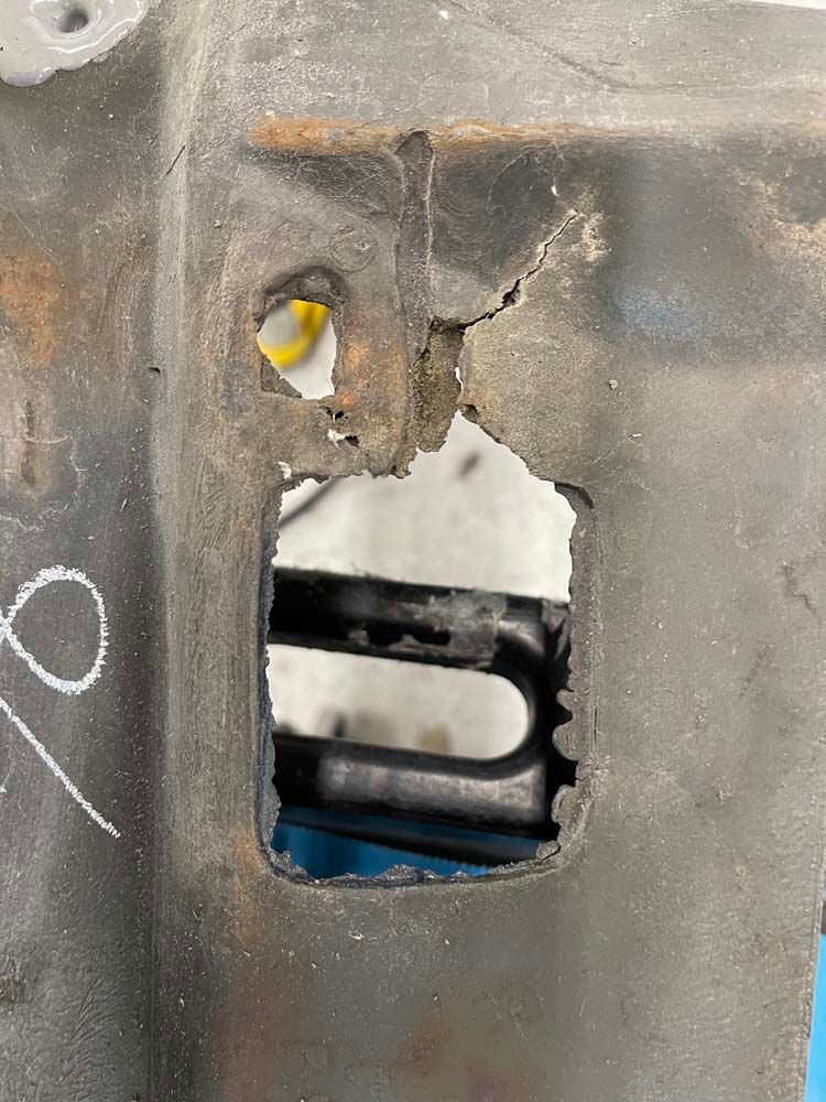 A close up of a piece of metal with a hole in it.