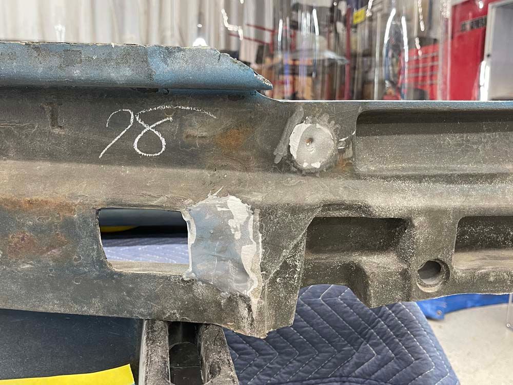 A piece of metal with a hole in it is sitting on a table.