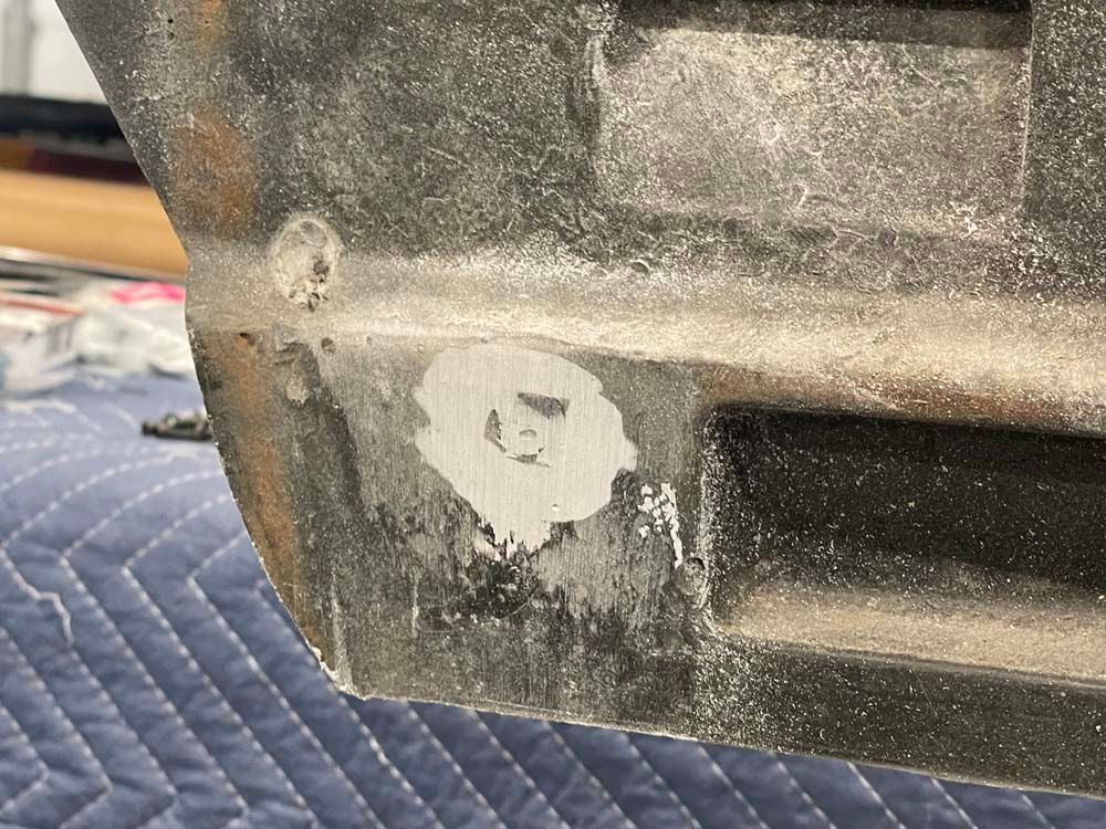 A close up of a piece of metal with a hole in it