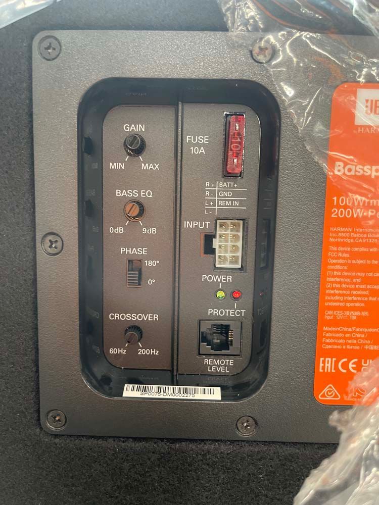 A close up of the back of a car subwoofer.