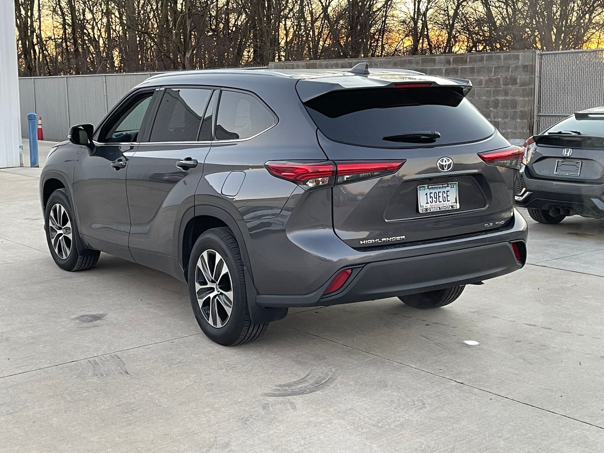 A toyota highlander is parked in a parking lot.