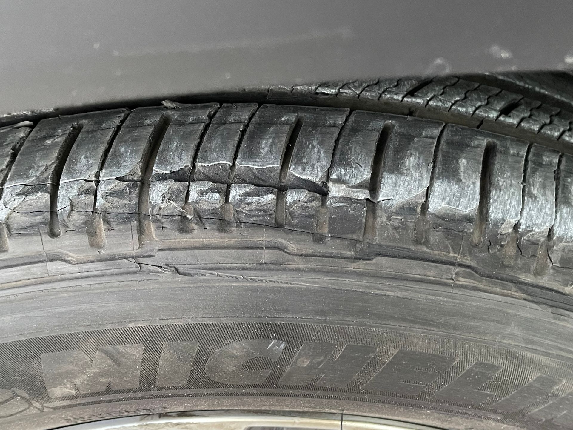 A close up of a worn out tire on a car.