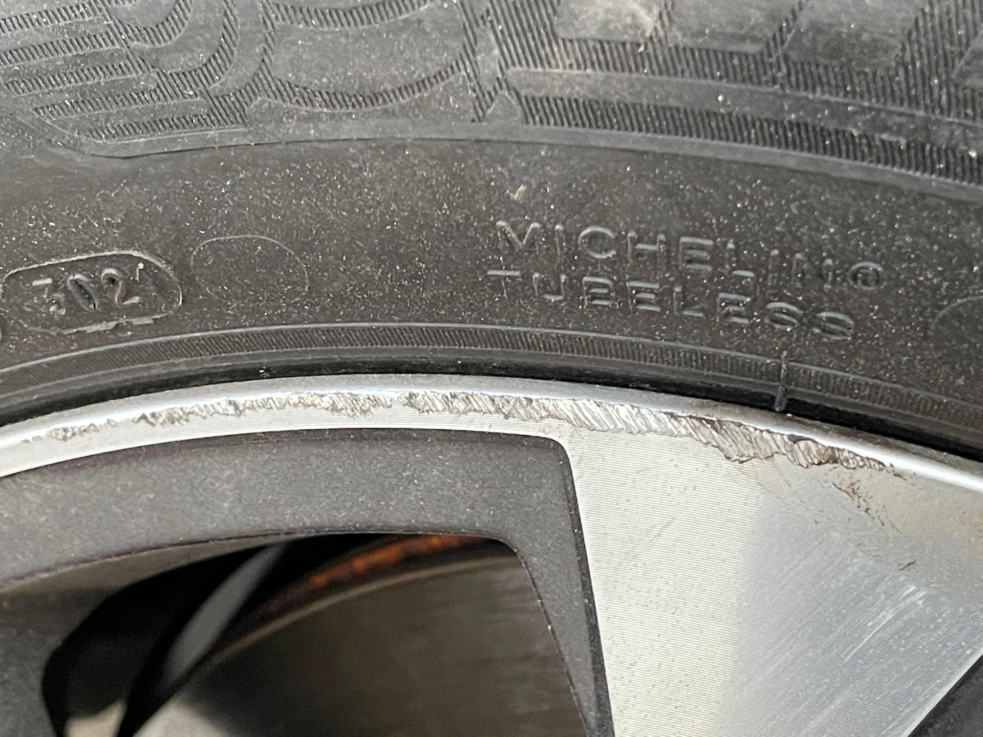 A close up of a tire on a car wheel
