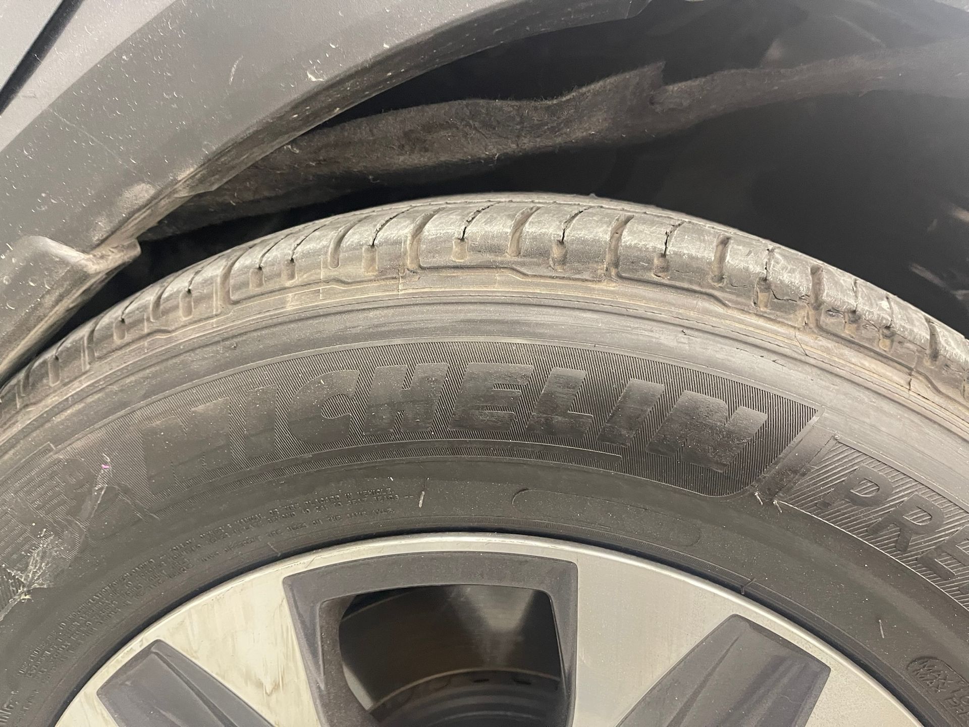 A close up of a tire on a car.