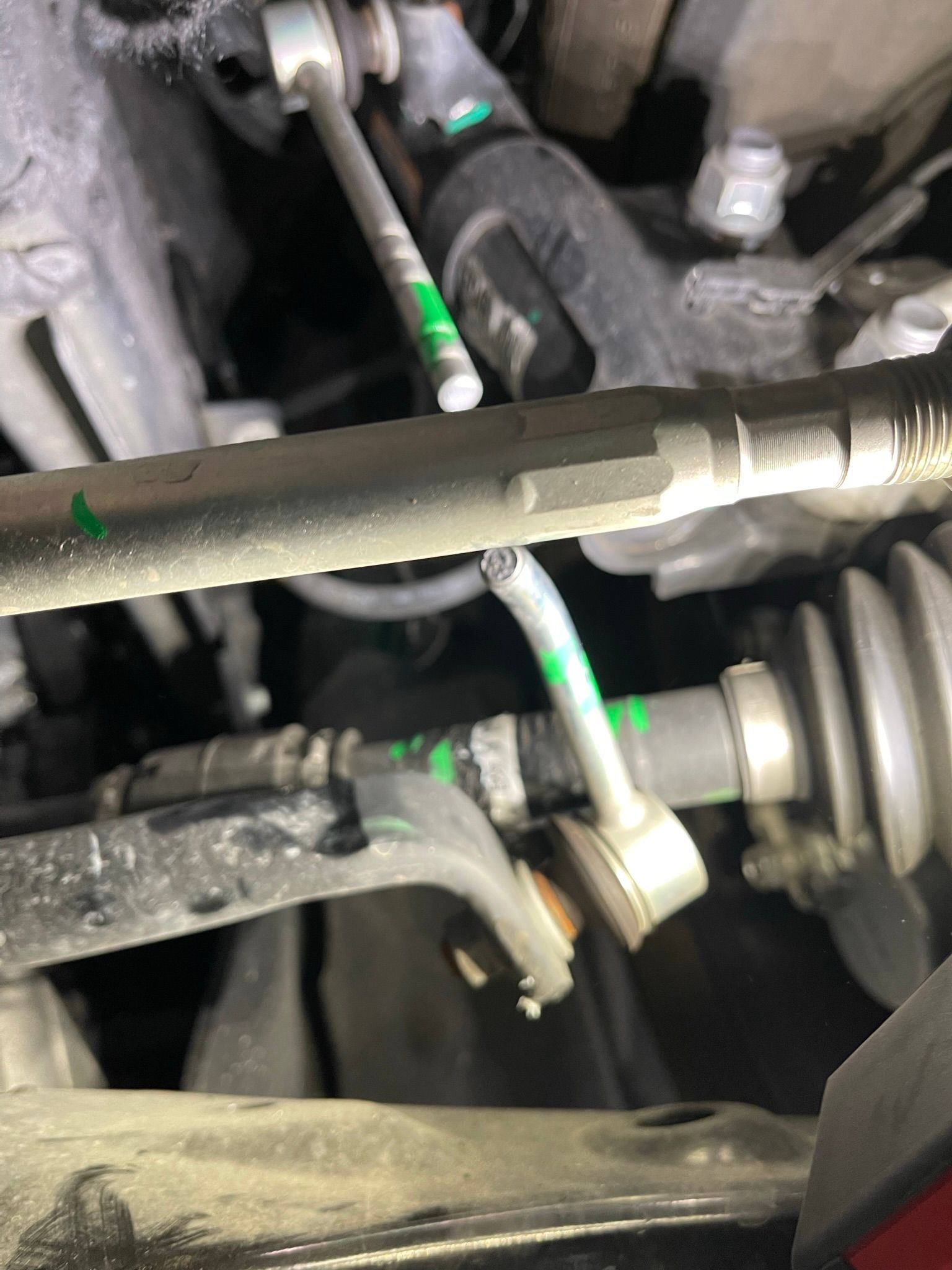 A close up of a steering gear on a car.