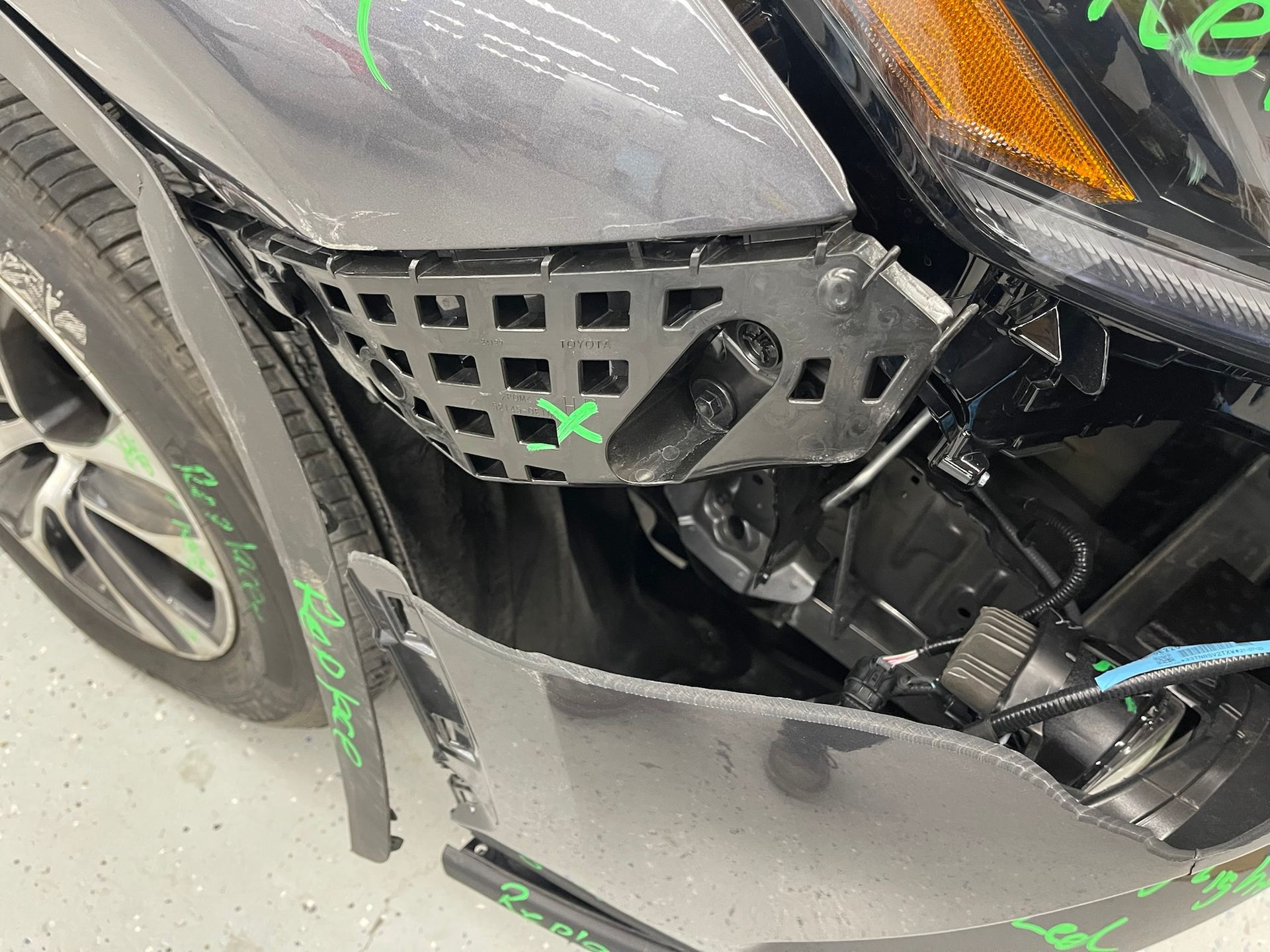 A close up of a car with the bumper removed.