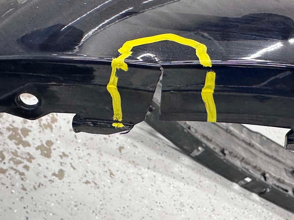 A black car with a yellow circle drawn on it
