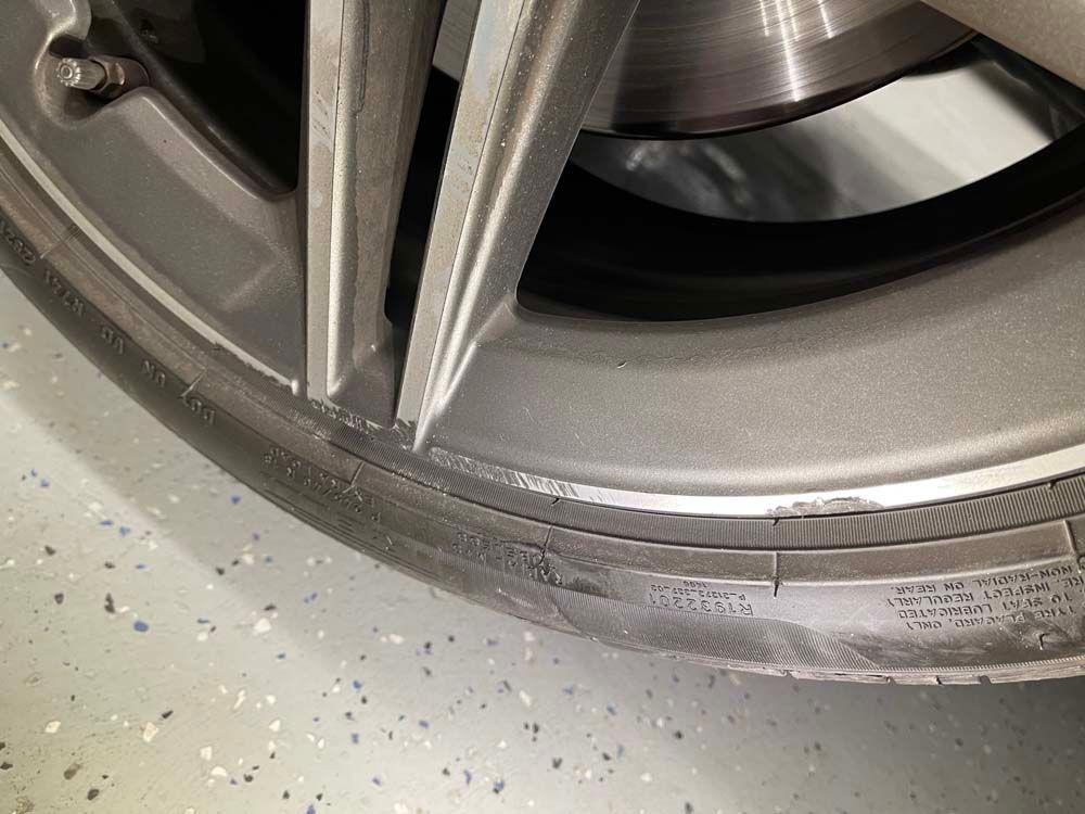 A close up of a tire on a car wheel