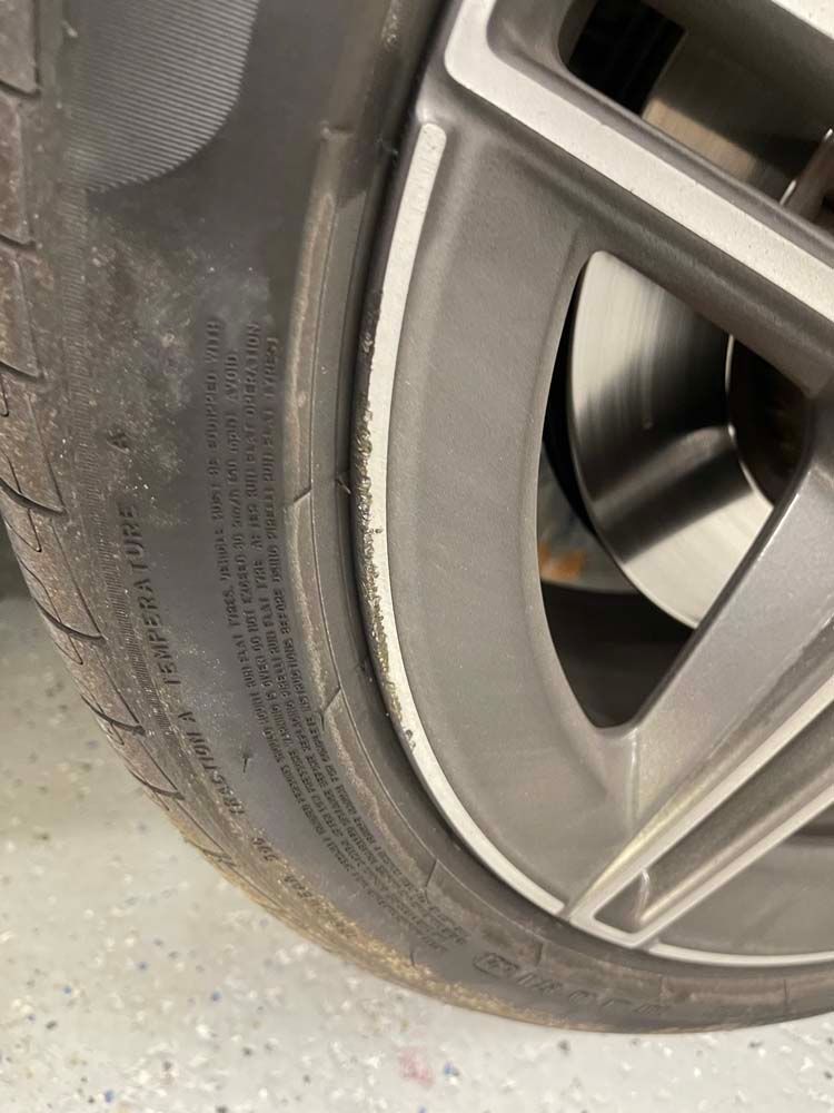 A close up of a tire on a car wheel.