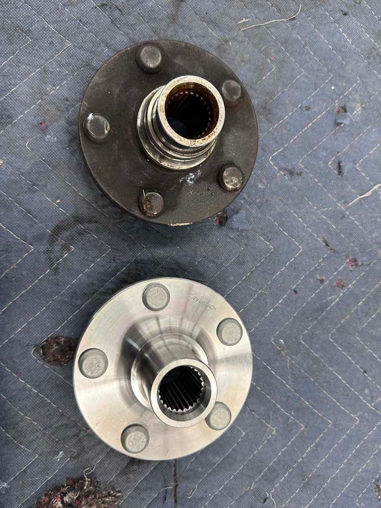 Two hubs are sitting on top of each other on a blue surface.