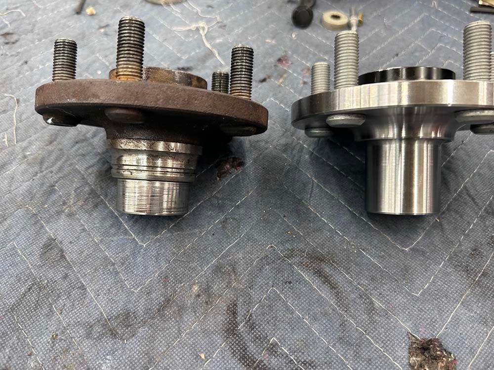 Two pieces of metal are sitting next to each other on a table.