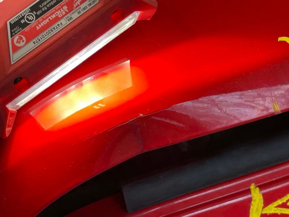 A red car with a red light on it