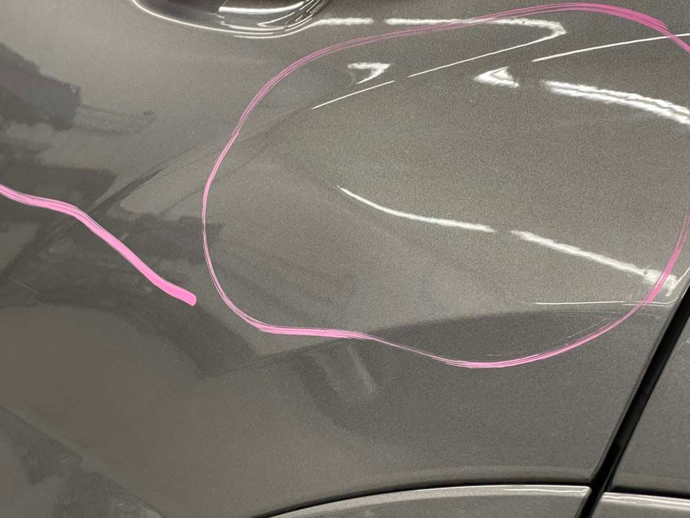 A close up of a car with a pink circle drawn on it