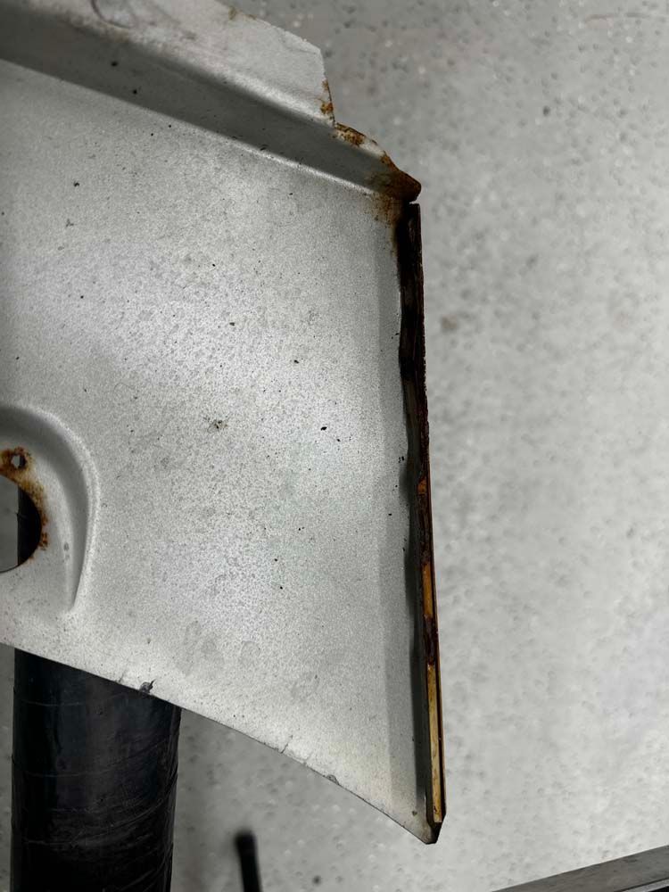 A close up of a piece of metal with rust on it.