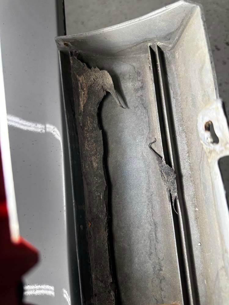 A close up of a piece of metal with a hole in it.