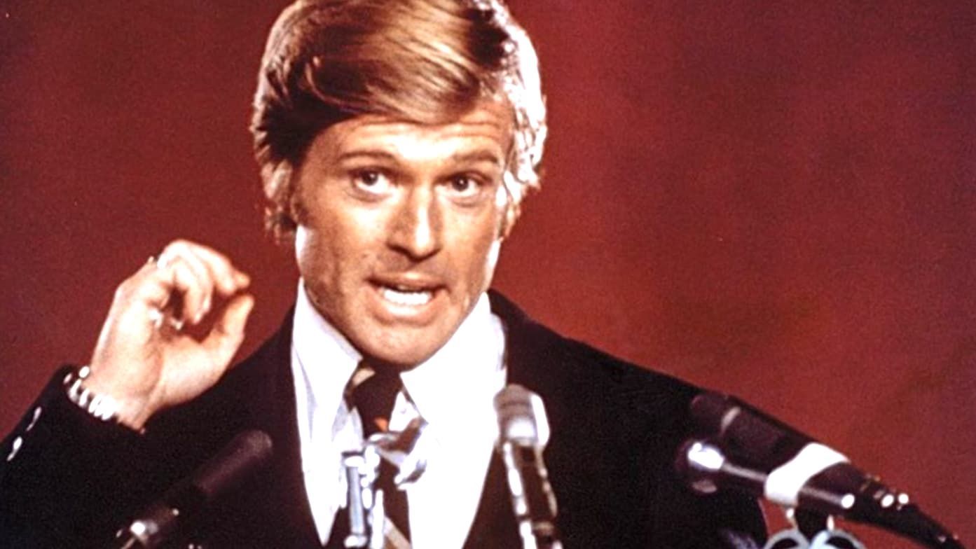 Robert Redford speaks at a public political rally.