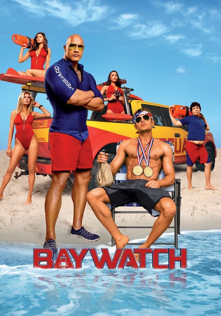 Baywatch movie poster: Rock and other lifeguards on beach in front of rescue truck, red and blue swimsuits.