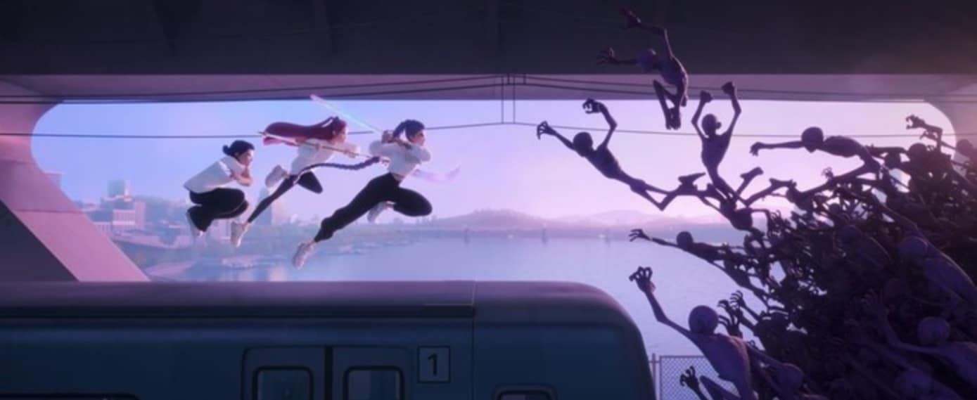 Michael Douglas in a convertible car, wearing sunglasses and a suit, looking to the side.