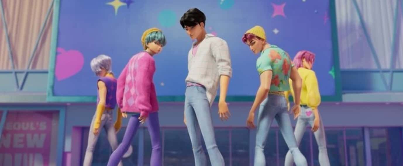 Paul Rudd holding Ant-Man helmet, standing near disassembled suit on a table in a dimly lit room.