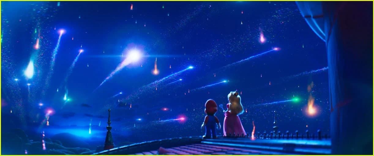 Michael Douglas in a convertible car, wearing sunglasses and a suit, looking to the side.