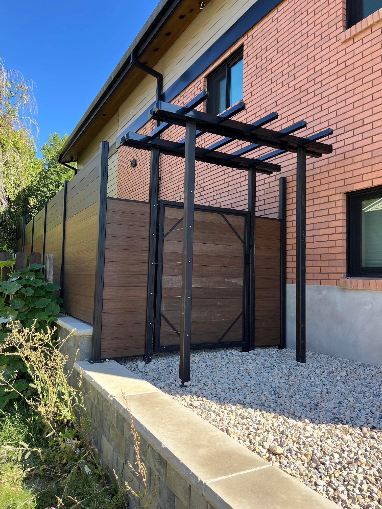 A kitchen with white cabinets , blue cabinets , stainless steel appliances , and a large island.