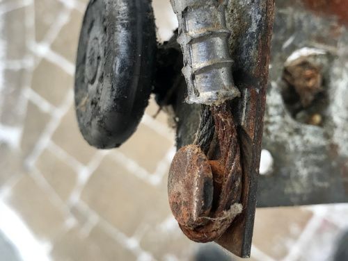 A close up of a rusty piece of metal on a table.