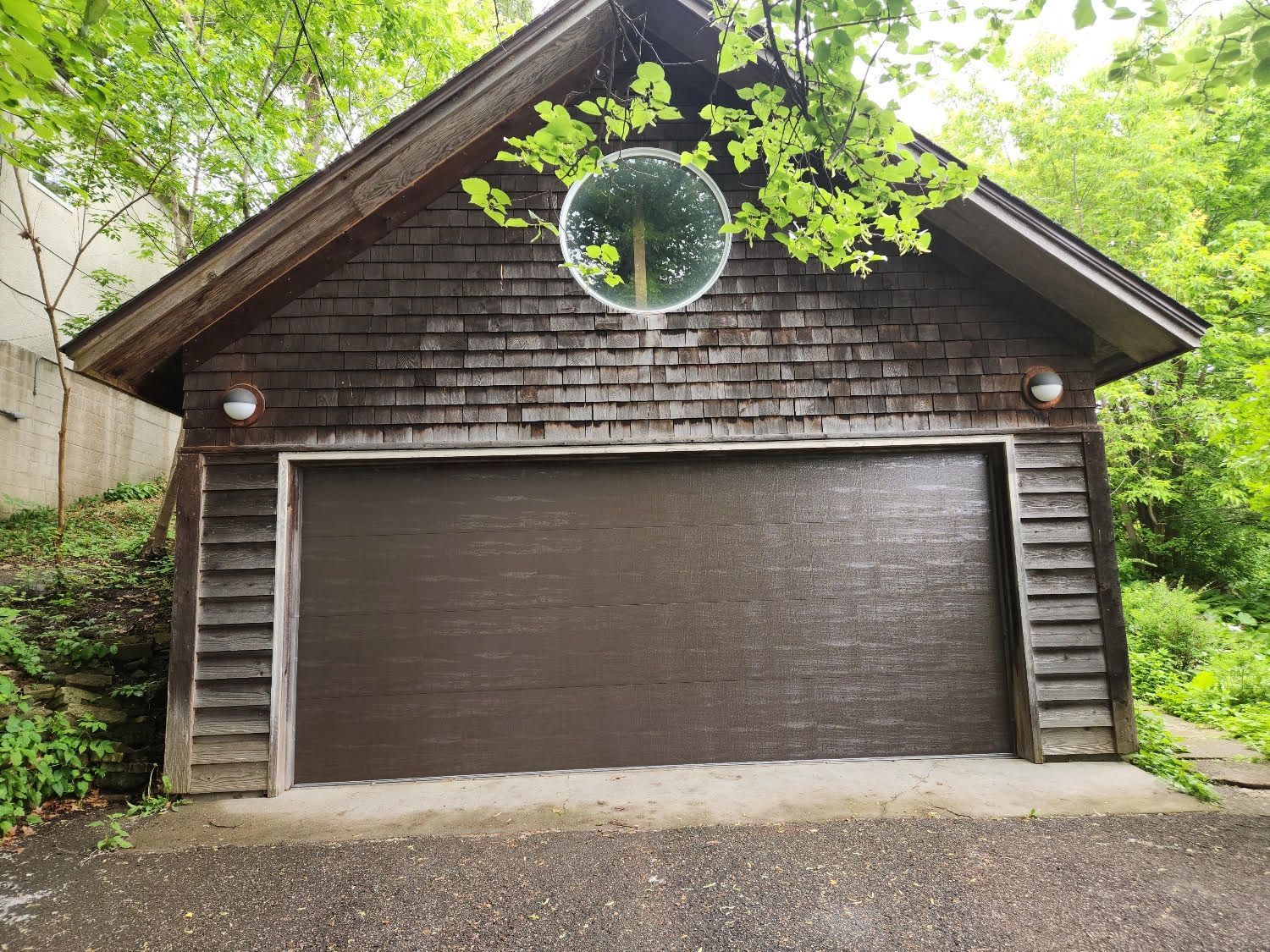 A garage with a clock on the side of it