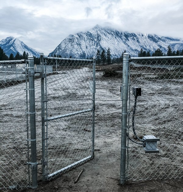 fence with electric gate locks installed by OTM systems at an outdoor cannabis grow in british columbia