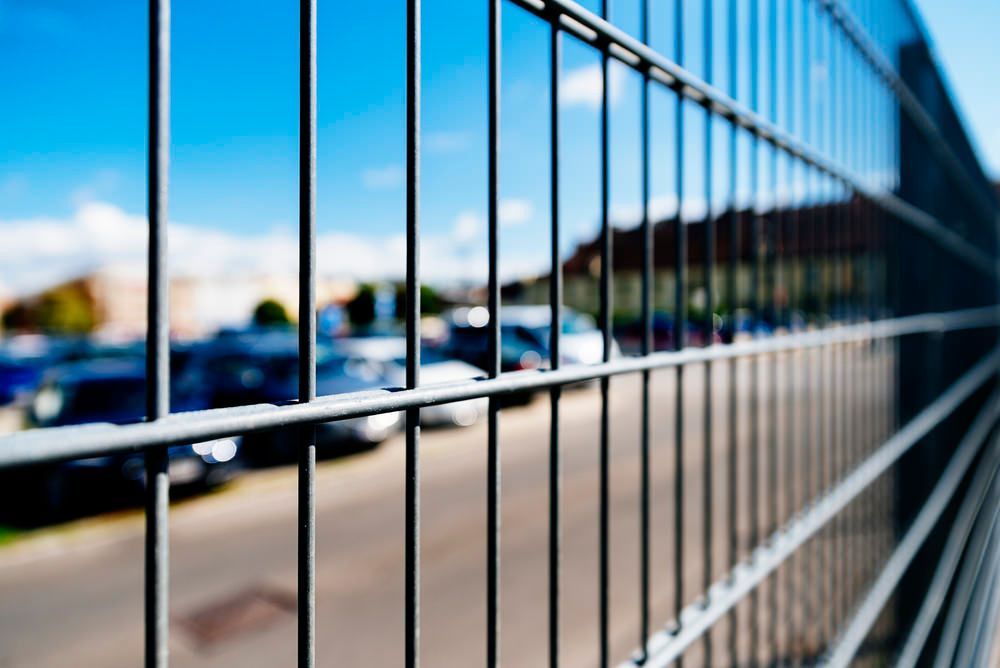 Security fencing around a car lot. 