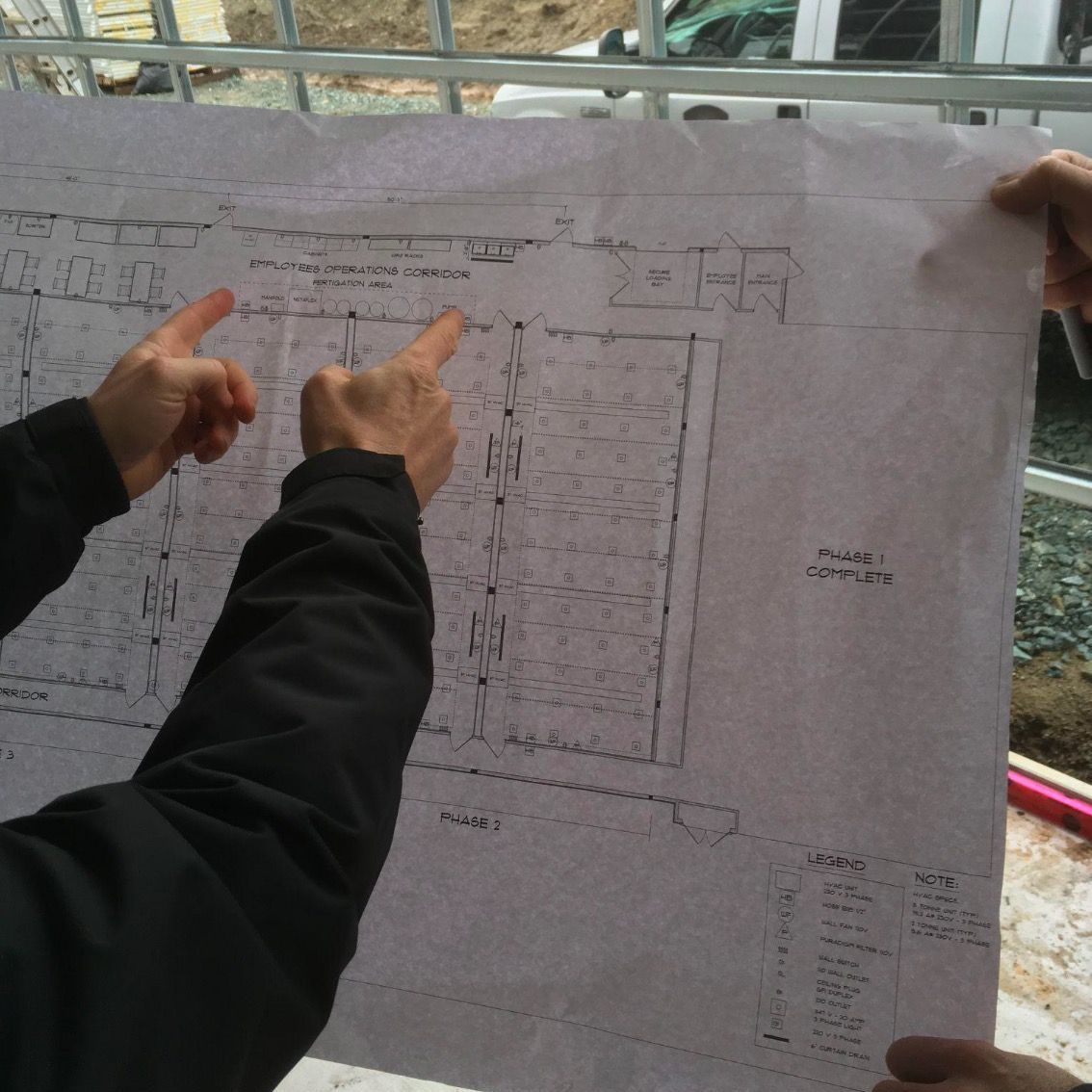 Jason from Otm Systems pointing at the security system drawing he created for an outdoor site that needed a security system.