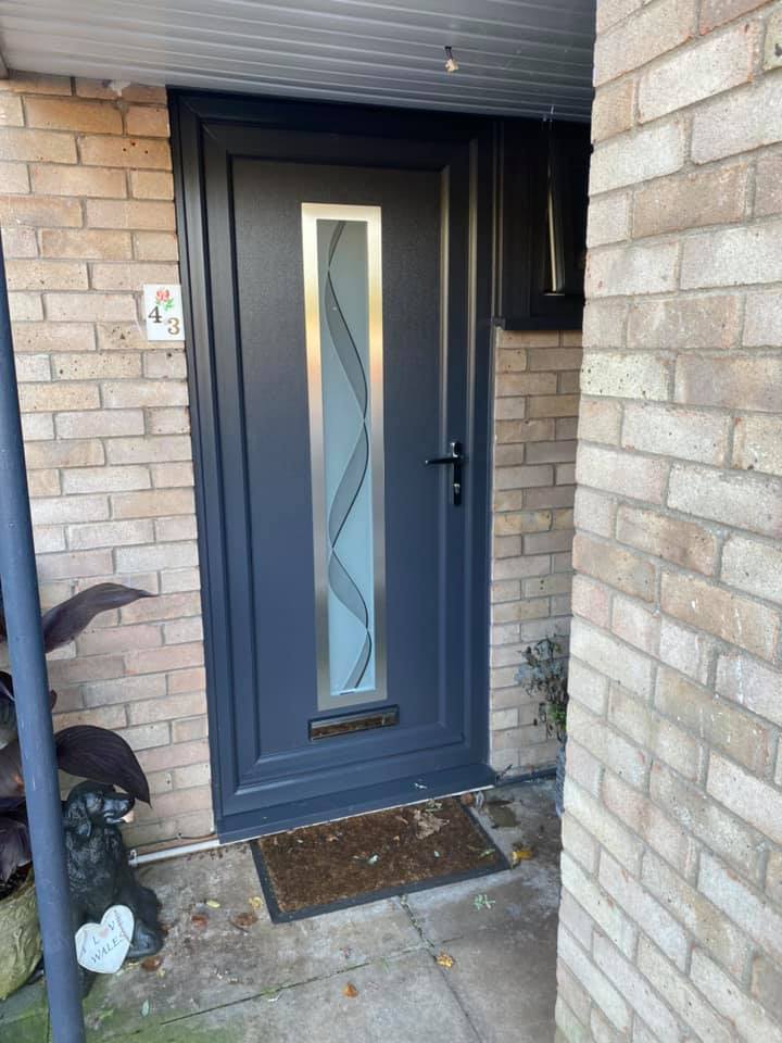grey composite door with glass panel