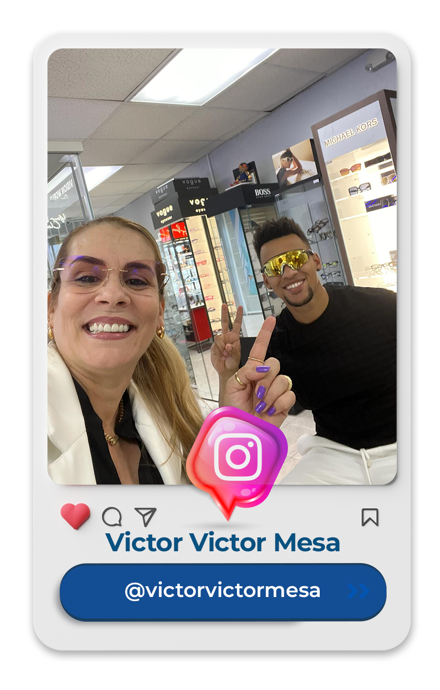 A woman and a man are posing for a picture in an optical shop.